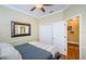 Bright bedroom with double doors leading to the bathroom at 19144 Meadow Pine Dr, Tampa, FL 33647