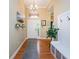 Light and airy entryway with hardwood floors and bench at 19144 Meadow Pine Dr, Tampa, FL 33647