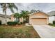 Attractive single-story house with a two-car garage and well-manicured lawn at 19144 Meadow Pine Dr, Tampa, FL 33647