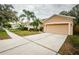 House exterior view with palm trees and a neighborhood street at 19144 Meadow Pine Dr, Tampa, FL 33647