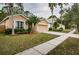 House exterior view with palm trees and a neighborhood street at 19144 Meadow Pine Dr, Tampa, FL 33647