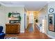 Bright hallway with hardwood floors and built-in bench at 19144 Meadow Pine Dr, Tampa, FL 33647