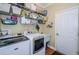 Laundry room with built in shelving and washer/dryer at 19144 Meadow Pine Dr, Tampa, FL 33647