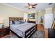 Spacious main bedroom with a king-size bed and access to the bathroom at 19144 Meadow Pine Dr, Tampa, FL 33647