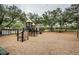 playground with play structures and wood chips at 19144 Meadow Pine Dr, Tampa, FL 33647