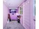 Fun playroom with purple walls, a TV, and plenty of space for  at 19144 Meadow Pine Dr, Tampa, FL 33647