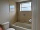 Bathtub and toilet in a well-lit bathroom at 2333 Feather Sound Dr # B301, Clearwater, FL 33762