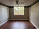 Bedroom with hardwood floors and a large window at 2333 Feather Sound Dr # B301, Clearwater, FL 33762