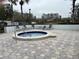 Relaxing community hot tub with surrounding patio at 2333 Feather Sound Dr # B301, Clearwater, FL 33762