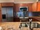 Stainless steel appliances and granite countertops in kitchen at 2333 Feather Sound Dr # B301, Clearwater, FL 33762