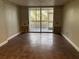 Living room with tile floors and sliding glass doors to balcony at 2333 Feather Sound Dr # B301, Clearwater, FL 33762