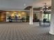 Condo lobby with chandelier and seating area at 2333 Feather Sound Dr # B301, Clearwater, FL 33762