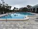 Community pool with lounge chairs and patio area at 2333 Feather Sound Dr # B301, Clearwater, FL 33762