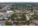 Wide shot of condo community near roads and businesses at 2375 Lake Heather Heights Ct # 202, Dunedin, FL 34698