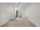 Bedroom with carpet flooring and access to bathroom and closet at 2375 Lake Heather Heights Ct # 202, Dunedin, FL 34698