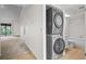 Stackable washer and dryer in a convenient laundry room at 2375 Lake Heather Heights Ct # 202, Dunedin, FL 34698