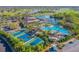 Aerial view of community pool, clubhouse, and other amenities at 2431 Kensington Greens Dr # 0, Sun City Center, FL 33573