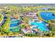 Aerial view of community amenities including pool, clubhouse, and tennis courts at 2431 Kensington Greens Dr # 0, Sun City Center, FL 33573