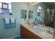 Double vanity bathroom with a mermaid-themed shower at 2431 Kensington Greens Dr # 0, Sun City Center, FL 33573