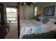 King-size bed in a tranquil Primary bedroom with golf course view at 2431 Kensington Greens Dr # 0, Sun City Center, FL 33573