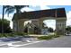 Gated community entrance with signage at 2431 Kensington Greens Dr # 0, Sun City Center, FL 33573