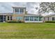 Back exterior view of the house with sunroom at 2431 Kensington Greens Dr # 0, Sun City Center, FL 33573