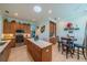 Open kitchen with stainless steel appliances and an island at 2431 Kensington Greens Dr # 0, Sun City Center, FL 33573