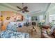 Bright and airy living room with fireplace and view into kitchen area at 2431 Kensington Greens Dr # 0, Sun City Center, FL 33573