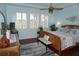 Large main bedroom with wood flooring and ceiling fan at 2431 Kensington Greens Dr # 0, Sun City Center, FL 33573