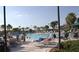 Resort-style pool with plenty of lounge chairs at 2431 Kensington Greens Dr # 0, Sun City Center, FL 33573