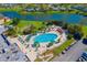 Large community pool with surrounding lounge chairs and landscaping at 2431 Kensington Greens Dr # 0, Sun City Center, FL 33573