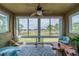 Sunroom with golf course view and comfortable seating at 2431 Kensington Greens Dr # 0, Sun City Center, FL 33573