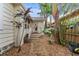 Landscaped backyard with brick pathway and lush tropical plants at 2545 2Nd N Ave, St Petersburg, FL 33713