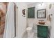 Updated bathroom with a copper sink, green vanity, and a shower stall at 2545 2Nd N Ave, St Petersburg, FL 33713