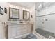 Elegant bathroom with dual vanity, marble countertops, and a walk-in shower at 2545 2Nd N Ave, St Petersburg, FL 33713