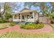 Charming bungalow with a brick pathway, lush landscaping, and a welcoming front porch at 2545 2Nd N Ave, St Petersburg, FL 33713