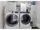 Bright laundry room with washer, dryer, and ample storage cabinets at 2545 2Nd N Ave, St Petersburg, FL 33713