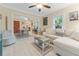 Bright living room with L-shaped sofa, light flooring, and views to dining area at 2545 2Nd N Ave, St Petersburg, FL 33713