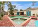 Inviting brick-paved pool area with spa and outdoor entertaining space at 2545 2Nd N Ave, St Petersburg, FL 33713