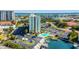 Aerial view of waterfront high-rise building with pool and boat slips at 255 Dolphin Pt Pt # 603, Clearwater Beach, FL 33767