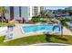 Community pool with surrounding patio and lounge chairs at 255 Dolphin Pt Pt # 603, Clearwater Beach, FL 33767