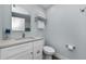 Small bathroom with white vanity and gray walls at 2749 Countryside Blvd # 18, Clearwater, FL 33761