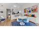 Bright dining area with white table and blue chairs, near kitchen at 2749 Countryside Blvd # 18, Clearwater, FL 33761