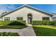 Front exterior view of the house, showcasing landscaping and walkway at 2749 Countryside Blvd # 18, Clearwater, FL 33761