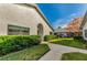 Exterior view showing manicured landscaping and a walkway at 2749 Countryside Blvd # 18, Clearwater, FL 33761