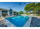 Inviting community pool area with surrounding lounge chairs at 2749 Countryside Blvd # 18, Clearwater, FL 33761