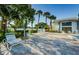 Spacious pool deck with numerous lounge chairs at 2749 Countryside Blvd # 18, Clearwater, FL 33761