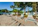 Relaxing pool deck with lounge chairs and patio furniture at 2749 Countryside Blvd # 18, Clearwater, FL 33761