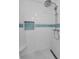 Clean shower with blue mosaic tile details at 2749 Countryside Blvd # 18, Clearwater, FL 33761