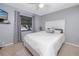 Bright bedroom with a queen-size bed and gray accents at 2893 Allapattah Dr, Clearwater, FL 33761